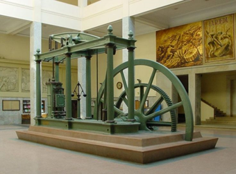 Máquina de vapor de James watt en verde expuesta en un museo